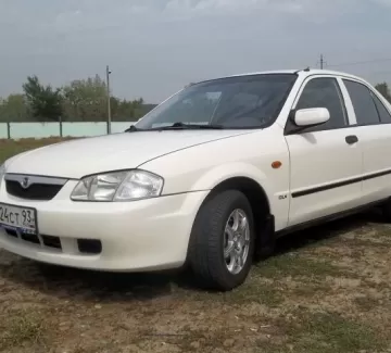 Купить Mazda 323 1600 см3 АКПП (107 л.с.) Бензин инжектор в Кропоткин: цвет белый Седан 1999 года по цене 210000 рублей, объявление №4688 на сайте Авторынок23