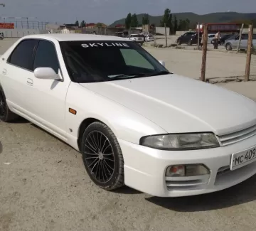 Купить Nissan Skyline 2000 см3 АКПП (130 л.с.) Бензиновый в Новороссийск: цвет белый Седан 1998 года по цене 235000 рублей, объявление №1114 на сайте Авторынок23