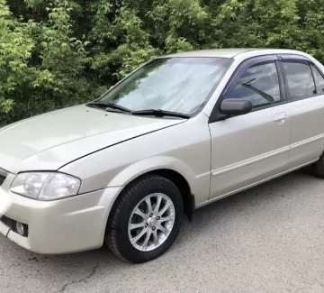 Купить Mazda Familia 1300 см3 АКПП (85 л.с.) Бензин инжектор в Темрюк : цвет Золотой Седан 1999 года по цене 235000 рублей, объявление №21966 на сайте Авторынок23