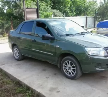 Купить ВАЗ (LADA) Granta 1600 см3 МКПП (87 л.с.) Бензин инжектор в Краснодар: цвет Зеленый металлик Седан 2013 года по цене 250000 рублей, объявление №1569 на сайте Авторынок23