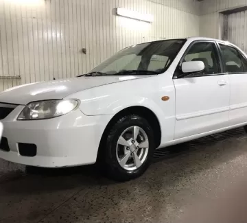 Купить Mazda Familia 1300 см3 АКПП (85 л.с.) Бензин инжектор в Холмская : цвет Белый Седан 1999 года по цене 225000 рублей, объявление №21972 на сайте Авторынок23