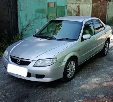 Купить Mazda Familia 1300 см3 АКПП (85 л.с.) Бензин инжектор в Нововеличковская: цвет Серый Седан 1999 года по цене 235000 рублей, объявление №21960 на сайте Авторынок23