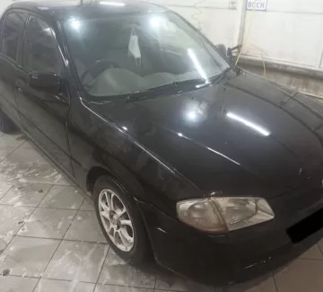 Купить Mazda Familia 1400 см3 АКПП (85 л.с.) Бензин инжектор в Славянск на Кубани: цвет Чёрный Седан 1999 года по цене 240000 рублей, объявление №20944 на сайте Авторынок23