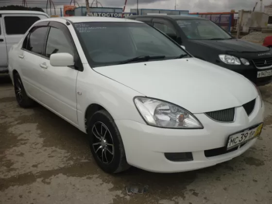 Купить Mitsubishi Lancer 1500 см3 АКПП (102 л.с.) Бензин инжектор в Новроссийск: цвет Белый Седан 2003 года по цене 245000 рублей, объявление №198 на сайте Авторынок23