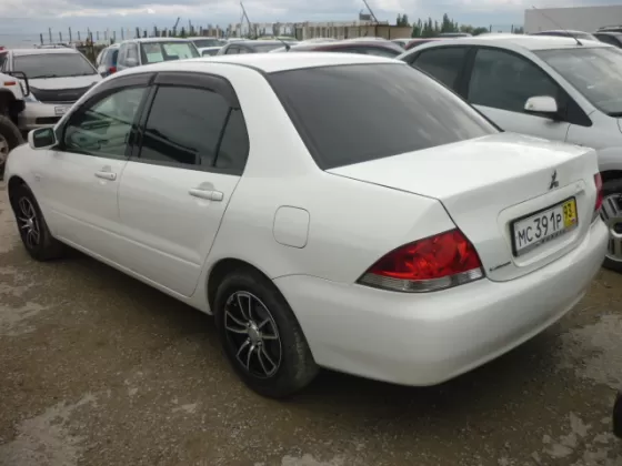 Купить Mitsubishi Lancer 1500 см3 АКПП (102 л.с.) Бензин инжектор в Новроссийск: цвет Белый Седан 2003 года по цене 245000 рублей, объявление №198 на сайте Авторынок23