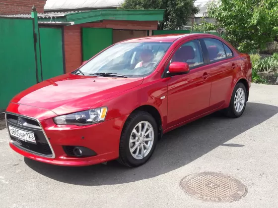 Купить Mitsubishi Lancer 10 1600 см3 МКПП (117 л.с.) Бензиновый в Краснодар: цвет красный металик Седан 2013 года по цене 710000 рублей, объявление №8812 на сайте Авторынок23