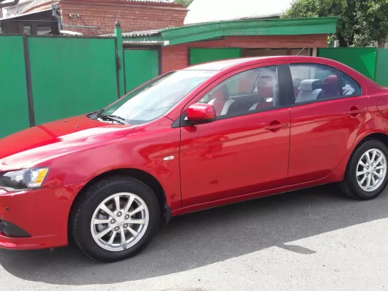 Купить Mitsubishi Lancer 10 1600 см3 МКПП (117 л.с.) Бензиновый в Краснодар: цвет красный металик Седан 2013 года по цене 710000 рублей, объявление №8812 на сайте Авторынок23