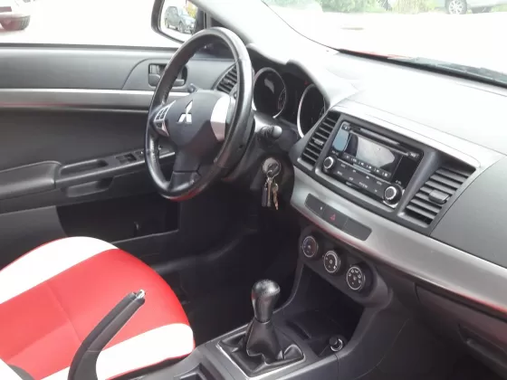 Купить Mitsubishi Lancer 10 1600 см3 МКПП (117 л.с.) Бензиновый в Краснодар: цвет красный металик Седан 2013 года по цене 710000 рублей, объявление №8812 на сайте Авторынок23