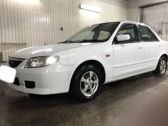 Купить Mazda Familia 1300 см3 АКПП (85 л.с.) Бензин инжектор в Холмская : цвет Белый Седан 1999 года по цене 225000 рублей, объявление №21972 на сайте Авторынок23