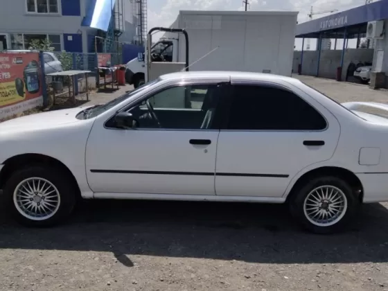 Купить Nissan Sunny 1500 см3 АКПП (105 л.с.) Бензин инжектор в Новотиторовская: цвет Белый Седан 1999 года по цене 340000 рублей, объявление №25599 на сайте Авторынок23