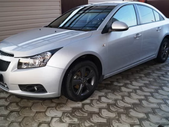 Купить Chevrolet Cruze '2012 АКПП (1800/141 л.с.) Бензин инжектор Ленинградская цвет серебристый металлик Седан по цене 539000 рублей, объявление №9628 на сайте Авторынок23