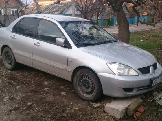 Купить Mitsubishi Lancer 9 1600 см3 МКПП (98 л.с.) Бензин инжектор в Краснодар: цвет серебро Седан 2006 года по цене 290000 рублей, объявление №5583 на сайте Авторынок23
