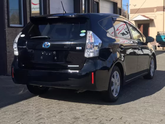 Купить Toyota Prius Alpha 1800 см3 АКПП (99 л.с.) Гибридный бензиновый в Краснодар: цвет черный Универсал 2014 года по цене 980000 рублей, объявление №21057 на сайте Авторынок23