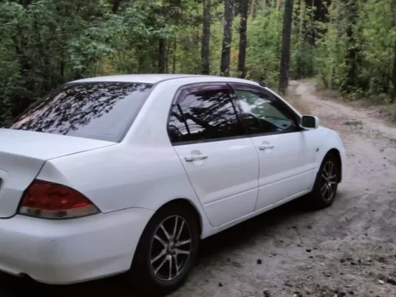 Купить Mitsubishi Lancer 1500 см3 МКПП (98 л.с.) Бензин инжектор в Темрюк: цвет Белый Седан 2003 года по цене 333000 рублей, объявление №26809 на сайте Авторынок23