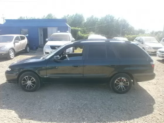 Купить Mazda Capella 1800 см3 АКПП (125 л.с.) Бензин инжектор в Усть-Лабинск: цвет Зеленый Универсал 1998 года по цене 160000 рублей, объявление №1723 на сайте Авторынок23