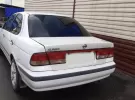 Купить Nissan Sunny 1495 см3 АКПП (105 л.с.) Бензин инжектор в Тамань: цвет Белый Седан 1998 года по цене 170000 рублей, объявление №24798 на сайте Авторынок23